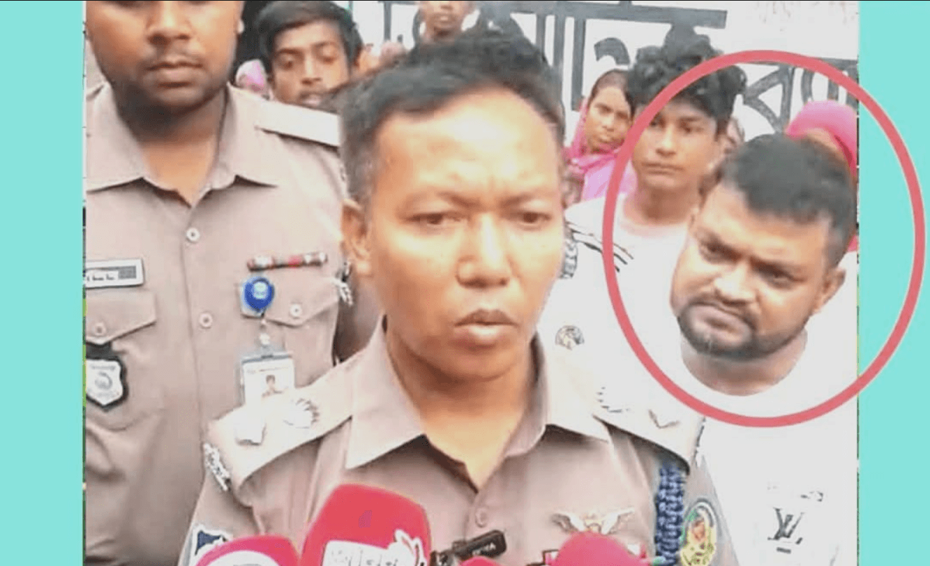 ‘পলাতক’ আসামি প্রকাশ্যে, ডিসির পাশে ভূমিকা নিয়ে প্রশ্ন